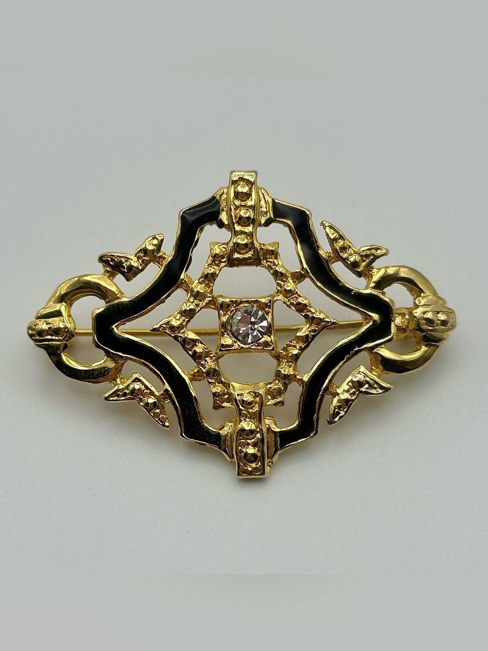 Decorative Filigree Brooch Pin with Center Crystal - Gold Tone, Black Enamel